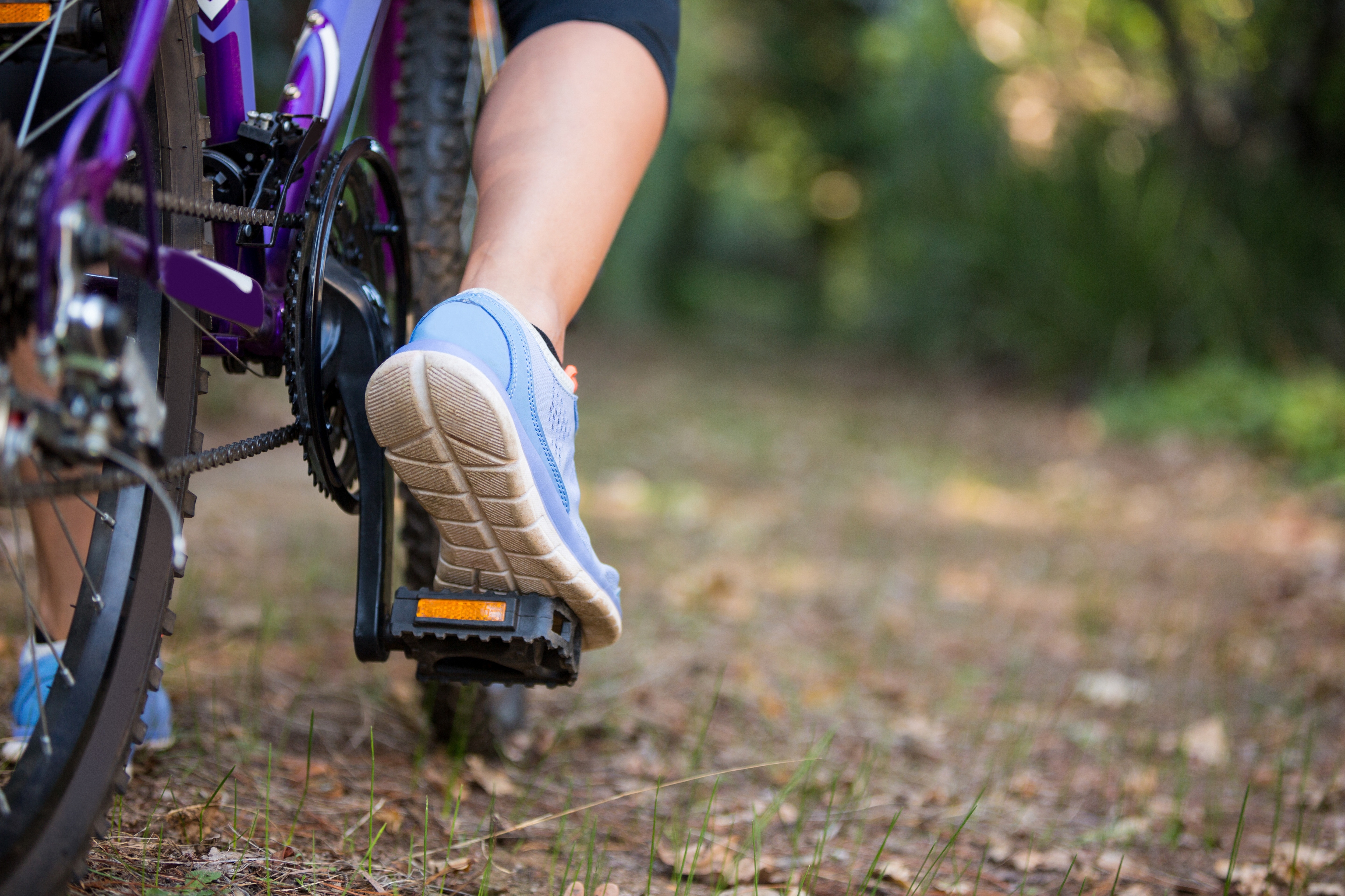 Female cyclist cycling in countryside