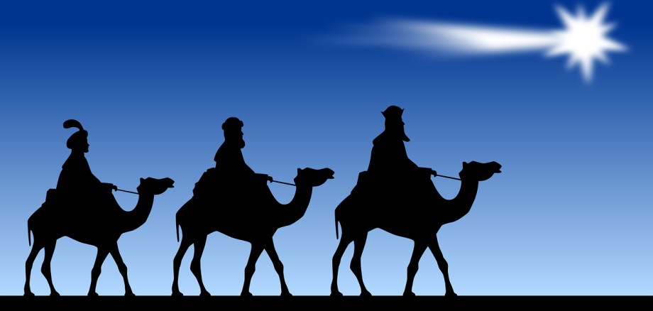 Die heiligen drei Könige auf Kamelen reiten einem Stern entgegen