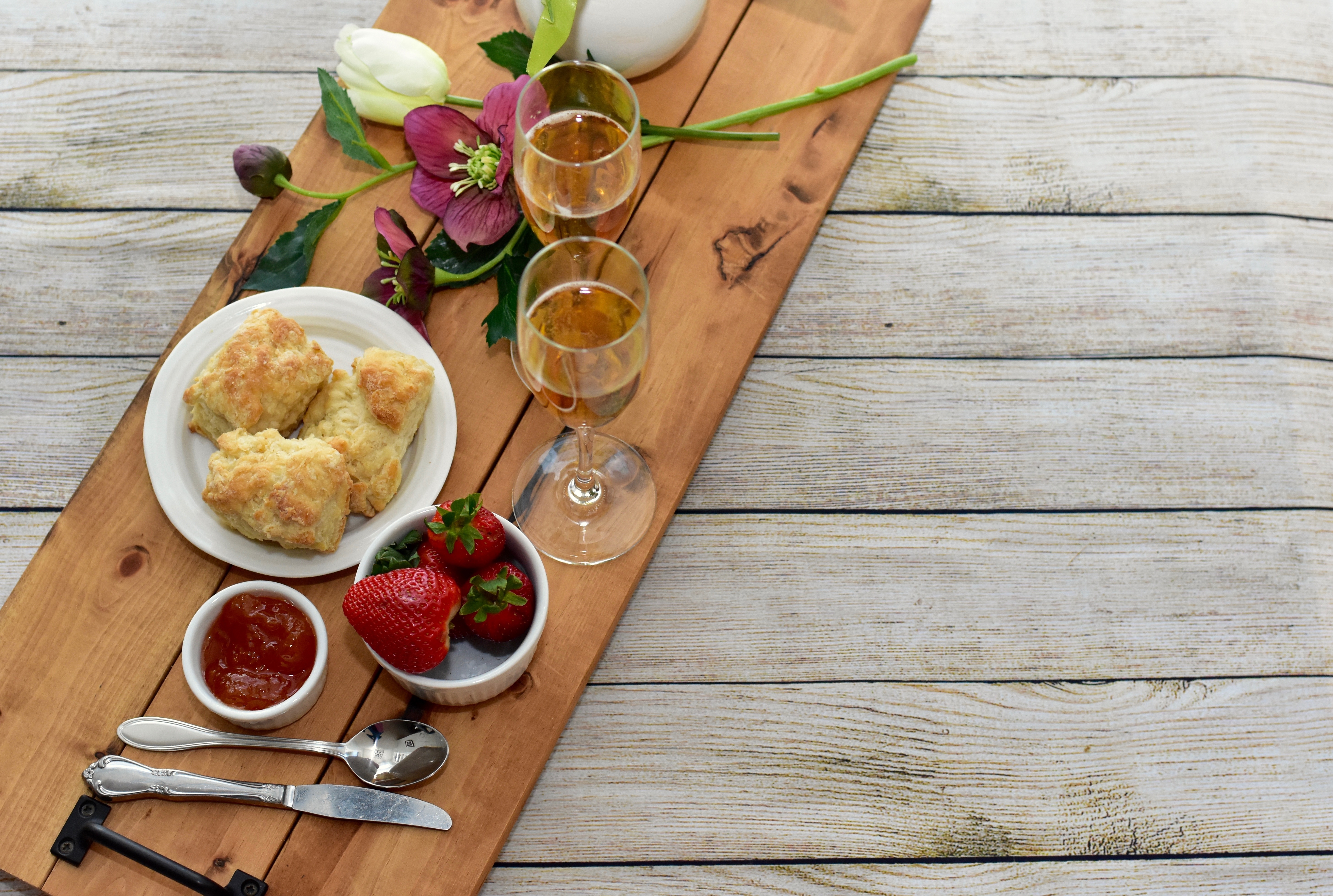Celebratory Mother's Day brunch for breakfast in bed to honour Mom with gourmet scones and preserves and champagne. 